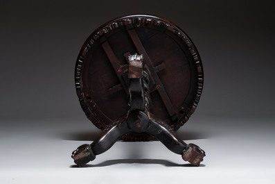 A Chinese mother-of-pearl-inlaid hongmu table with a circular Canton famille verte 'warriors on horseback' plaque, 19th C.