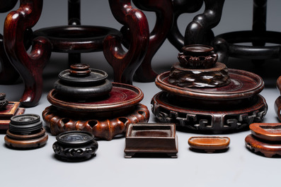 A collection of 30 Chinese wooden stands, 19/20th C.