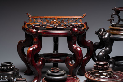 A collection of 30 Chinese wooden stands, 19/20th C.