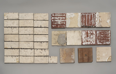 11 William de Morgan Persian-style tiles with floral design and 22 Poole pottery border tiles, 19/20th C.