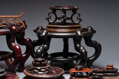A collection of 30 Chinese wooden stands, 19/20th C.