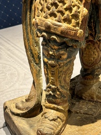 A large Chinese polychrome-lacquered wooden figure of a Guardian King, 18/19th C.