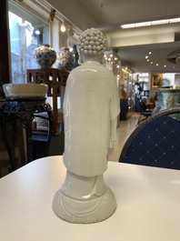 Two Chinese Dehua blanc de Chine Buddha and Wenchang figures, a seal paste covered box, a vase and an iron-red-glazed boy, Qianlong mark, 19/20th C.