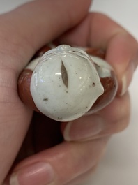 Two Chinese Dehua blanc de Chine Buddha and Wenchang figures, a seal paste covered box, a vase and an iron-red-glazed boy, Qianlong mark, 19/20th C.