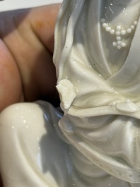 Two Chinese Dehua blanc de Chine figures of Guanyin and Shoulao and a pair of Buddhist lions, He Chaozong 何朝宗 mark, 18/19th C.