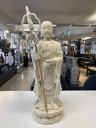 A Chinese Dehua blanc de Chine monk and a Guanyin, He Chaozong 何朝宗 and Dehua 德化 marks, 20th C.