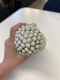 Two Chinese Dehua blanc de Chine Buddha and Wenchang figures, a seal paste covered box, a vase and an iron-red-glazed boy, Qianlong mark, 19/20th C.