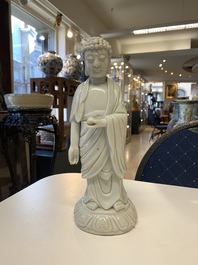 Two Chinese Dehua blanc de Chine Buddha and Wenchang figures, a seal paste covered box, a vase and an iron-red-glazed boy, Qianlong mark, 19/20th C.