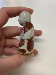 Two Chinese Dehua blanc de Chine Buddha and Wenchang figures, a seal paste covered box, a vase and an iron-red-glazed boy, Qianlong mark, 19/20th C.