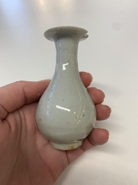 Two Chinese Dehua blanc de Chine Buddha and Wenchang figures, a seal paste covered box, a vase and an iron-red-glazed boy, Qianlong mark, 19/20th C.