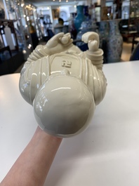 A Chinese Dehua blanc de Chine monk and a Guanyin, He Chaozong 何朝宗 and Dehua 德化 marks, 20th C.