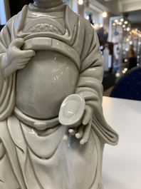 Two Chinese Dehua blanc de Chine Buddha and Wenchang figures, a seal paste covered box, a vase and an iron-red-glazed boy, Qianlong mark, 19/20th C.