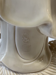 A Chinese Dehua blanc de Chine monk and a Guanyin, He Chaozong 何朝宗 and Dehua 德化 marks, 20th C.