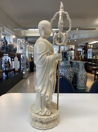 A Chinese Dehua blanc de Chine monk and a Guanyin, He Chaozong 何朝宗 and Dehua 德化 marks, 20th C.