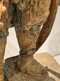 A large Chinese polychrome-lacquered wooden figure of a Guardian King, 18/19th C.
