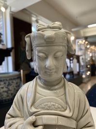 Two Chinese Dehua blanc de Chine Buddha and Wenchang figures, a seal paste covered box, a vase and an iron-red-glazed boy, Qianlong mark, 19/20th C.