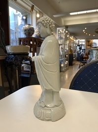 Two Chinese Dehua blanc de Chine Buddha and Wenchang figures, a seal paste covered box, a vase and an iron-red-glazed boy, Qianlong mark, 19/20th C.