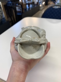 Two Chinese Dehua blanc de Chine Buddha and Wenchang figures, a seal paste covered box, a vase and an iron-red-glazed boy, Qianlong mark, 19/20th C.