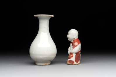 Two Chinese Dehua blanc de Chine Buddha and Wenchang figures, a seal paste covered box, a vase and an iron-red-glazed boy, Qianlong mark, 19/20th C.