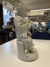 Two Chinese Dehua blanc de Chine Buddha and Wenchang figures, a seal paste covered box, a vase and an iron-red-glazed boy, Qianlong mark, 19/20th C.