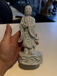 Two Chinese Dehua blanc de Chine figures of Guanyin and Shoulao and a pair of Buddhist lions, He Chaozong 何朝宗 mark, 18/19th C.