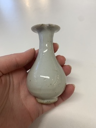 Two Chinese Dehua blanc de Chine Buddha and Wenchang figures, a seal paste covered box, a vase and an iron-red-glazed boy, Qianlong mark, 19/20th C.