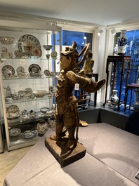 A large Chinese polychrome-lacquered wooden figure of a Guardian King, 18/19th C.