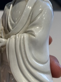 Two Chinese Dehua blanc de Chine figures of Guanyin and Shoulao and a pair of Buddhist lions, He Chaozong 何朝宗 mark, 18/19th C.