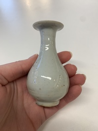 Two Chinese Dehua blanc de Chine Buddha and Wenchang figures, a seal paste covered box, a vase and an iron-red-glazed boy, Qianlong mark, 19/20th C.