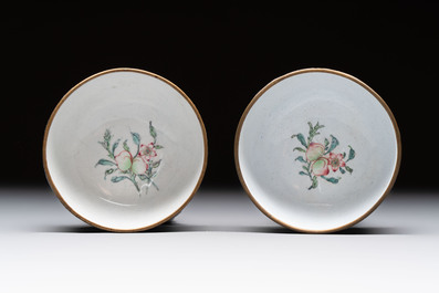 A pair of Chinese yellow-ground Canton enamel covered bowls and two cups, Yongzheng/Qianlong