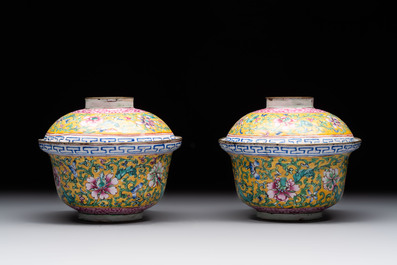 A pair of Chinese yellow-ground Canton enamel covered bowls and two cups, Yongzheng/Qianlong