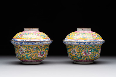 A pair of Chinese yellow-ground Canton enamel covered bowls and two cups, Yongzheng/Qianlong