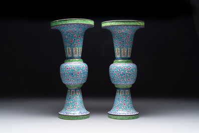 A pair of Chinese Canton enamel 'gu' vases with floral design, Qianlong