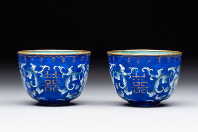 A pair of Chinese Canton enamel 'double happiness 囍' trembleuse cups and saucers, Qianlong/Jiaqing