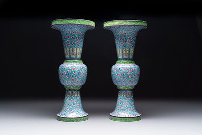 A pair of Chinese Canton enamel 'gu' vases with floral design, Qianlong