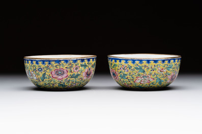 A pair of Chinese yellow-ground Canton enamel covered bowls and two cups, Yongzheng/Qianlong