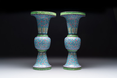 A pair of Chinese Canton enamel 'gu' vases with floral design, Qianlong