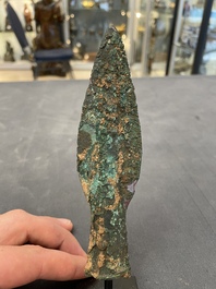 Four Chinese and Vietnamese bronze axes and an arrowhead, Western Zhou/Dong Son