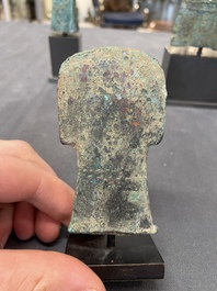 Four Chinese and Vietnamese bronze axes and an arrowhead, Western Zhou/Dong Son