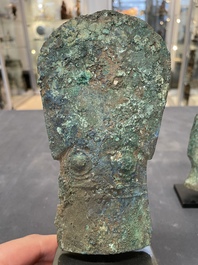 Four Chinese and Vietnamese bronze axes and an arrowhead, Western Zhou/Dong Son