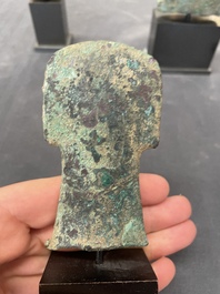 Four Chinese and Vietnamese bronze axes and an arrowhead, Western Zhou/Dong Son