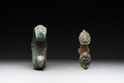 A bronze mirror, a bracelet with a royal or noble emblem and a bronze bracelet with two tiger heads, Cambodia, 12th C.