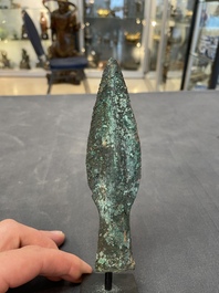 Four Chinese and Vietnamese bronze axes and an arrowhead, Western Zhou/Dong Son