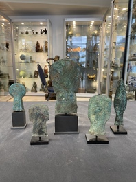 Four Chinese and Vietnamese bronze axes and an arrowhead, Western Zhou/Dong Son