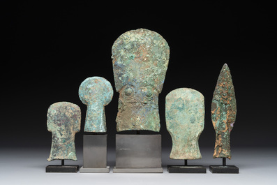 Four Chinese and Vietnamese bronze axes and an arrowhead, Western Zhou/Dong Son