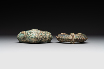A bronze mirror, a bracelet with a royal or noble emblem and a bronze bracelet with two tiger heads, Cambodia, 12th C.