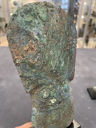 Four Chinese and Vietnamese bronze axes and an arrowhead, Western Zhou/Dong Son