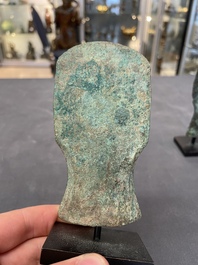 Four Chinese and Vietnamese bronze axes and an arrowhead, Western Zhou/Dong Son