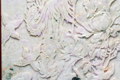 A Chinese lavender and green jadeite 'phoenix' plaque in a hongmu frame, early 20th C.