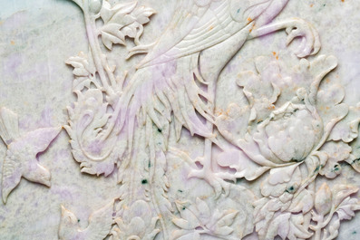 A Chinese lavender and green jadeite 'phoenix' plaque in a hongmu frame, early 20th C.